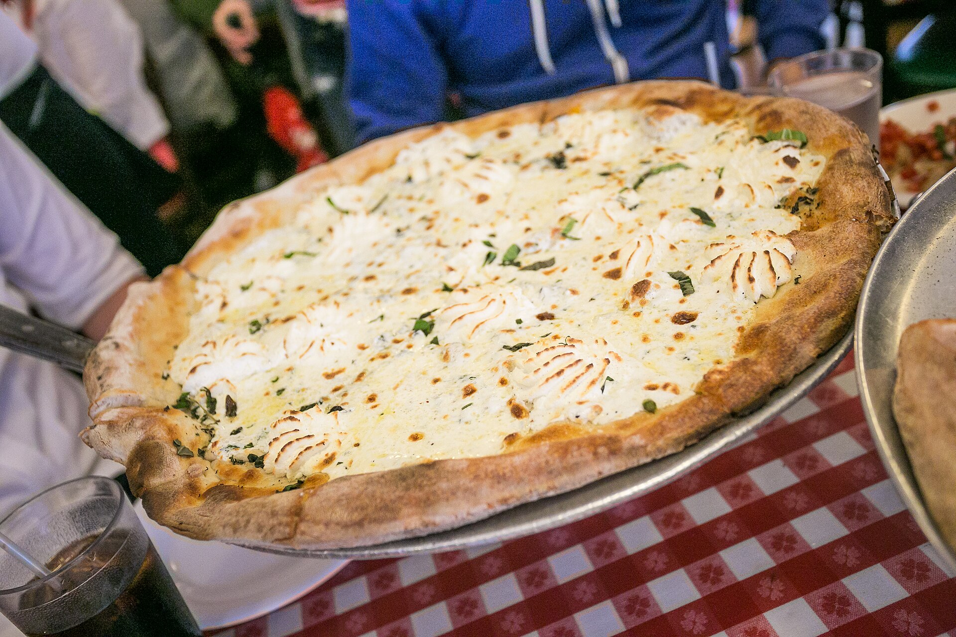 White pizza bianca with ricotta and herbs