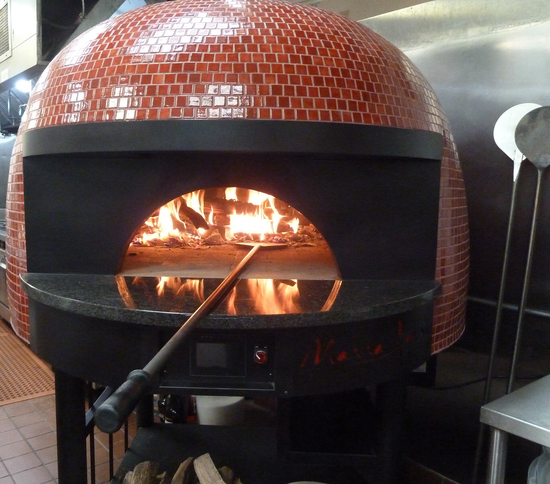 Wood-fired pizza oven with fresh pizza