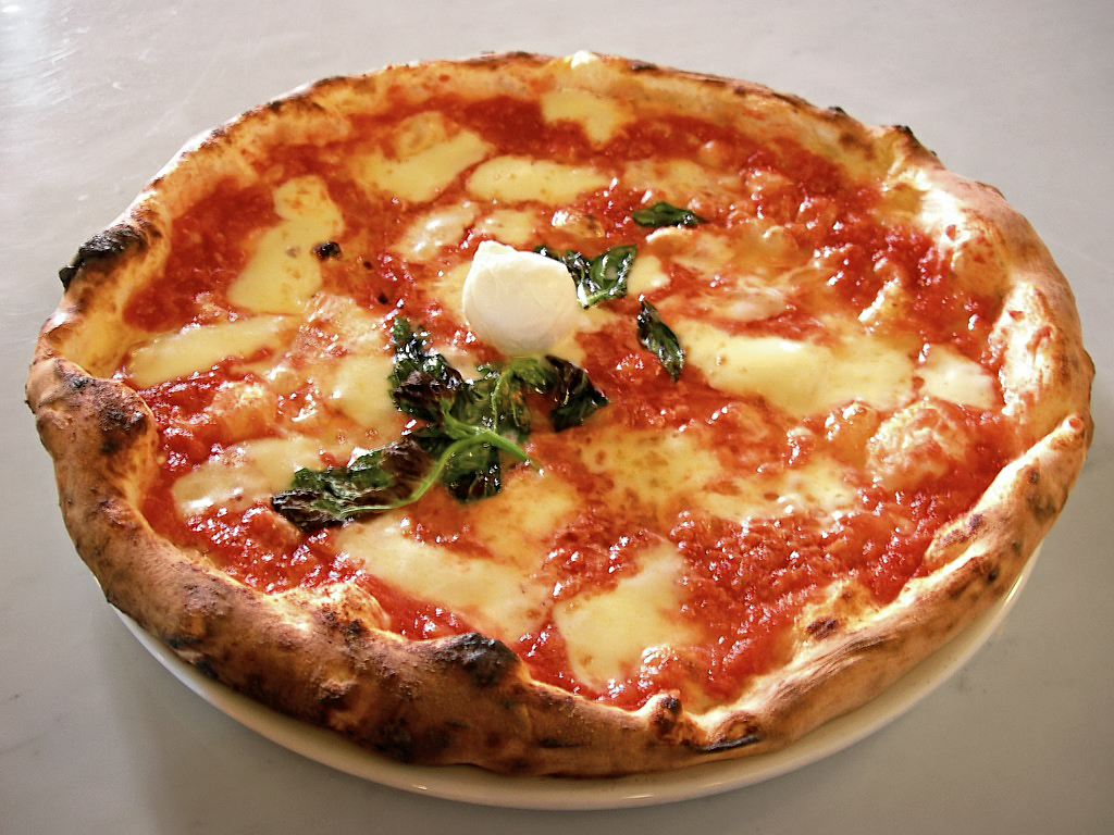 Classic Neapolitan pizza with basil and mozzarella